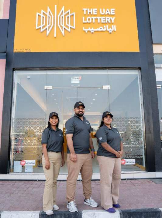 lottery store workers standing in front of the store 